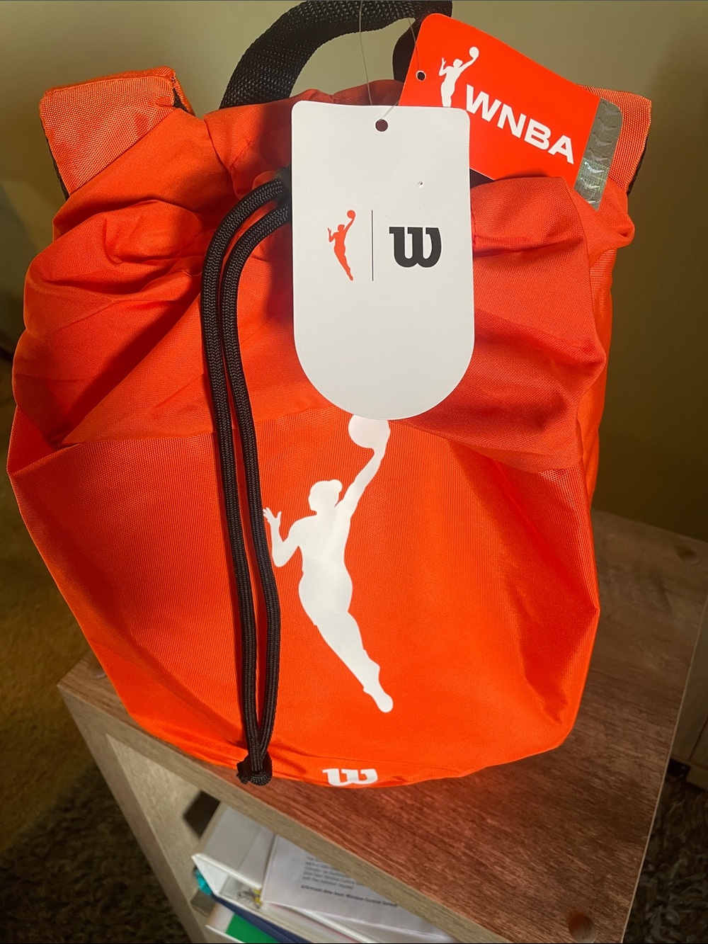 NBA Orange Drawstring Backpack with Black Cords and White Logo